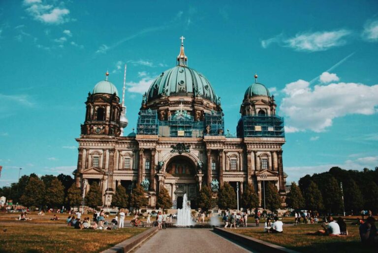 Berlin Cathedral with park and people relaxing on a sunny day