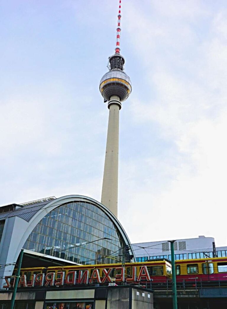 The Fernsehturm tower stands tall above the Alexanderplatz building