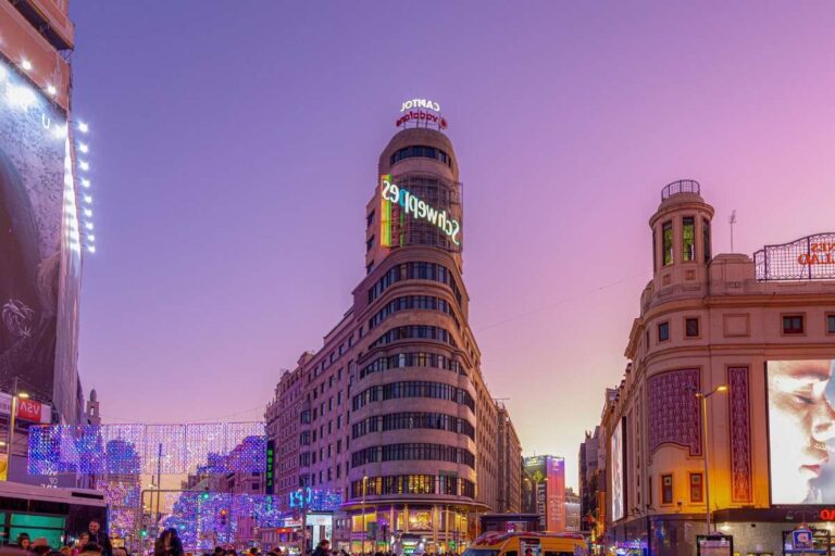 Gran Vía at twilight with Capitol Building and neon light