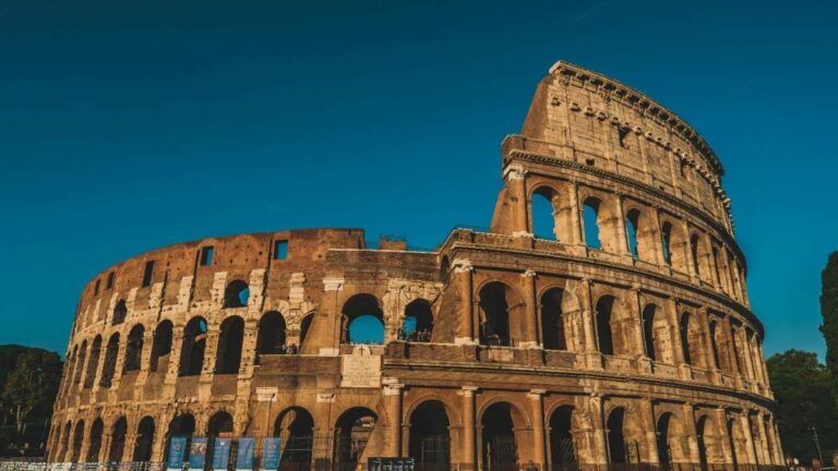 The ancient Roman Colosseum against a clear blue sky