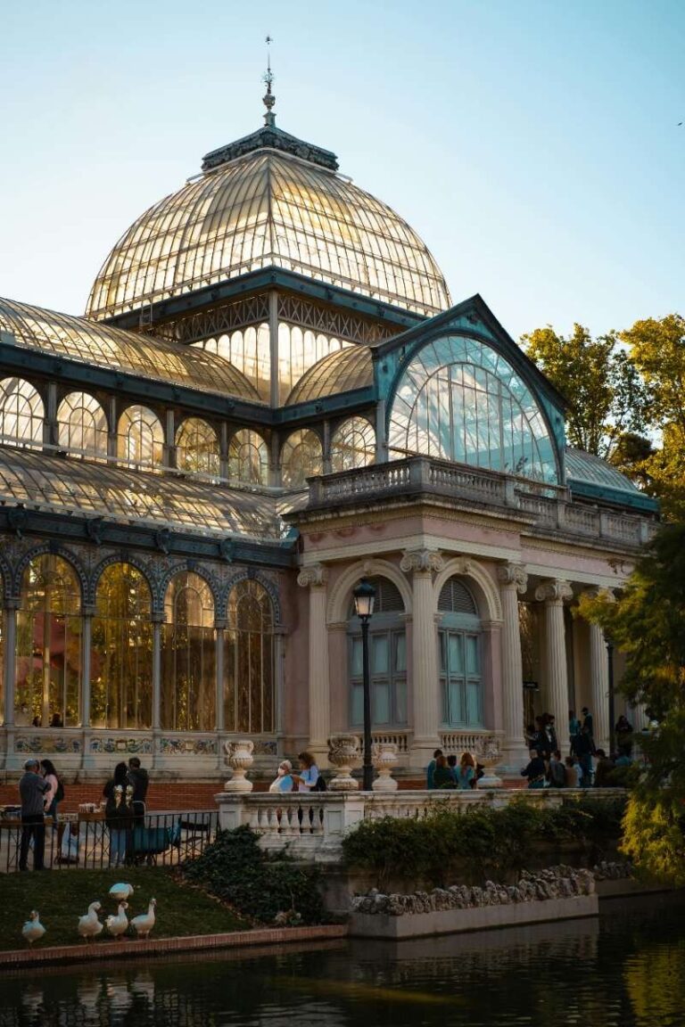 Palacio de Cristal in Madrid’s Retiro Park with reflections in water