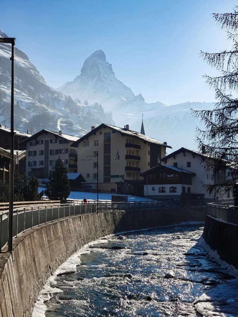 View of the Matterhorn mountain with snow-capped peaks and stream