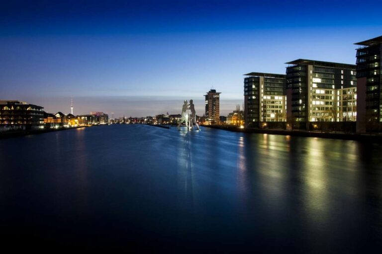 Night view of Spree River in Berlin with Molecule Man and city lights