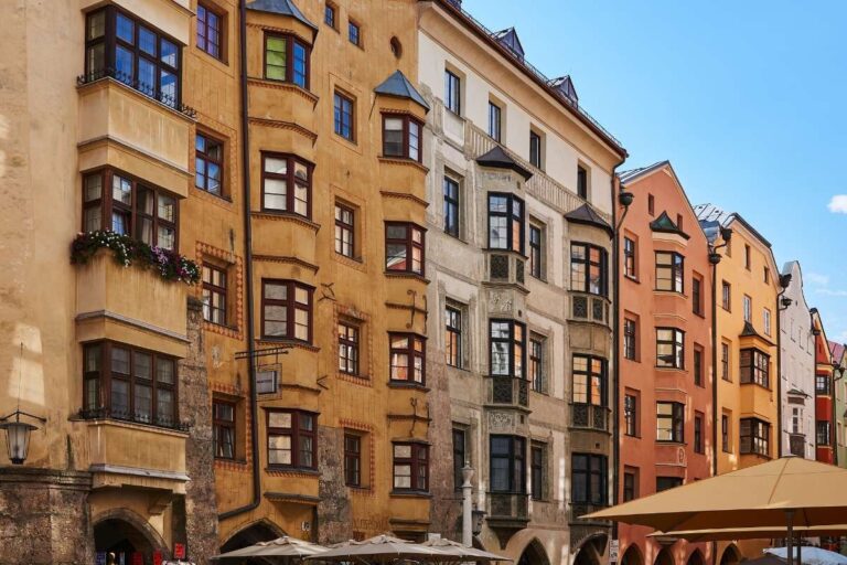 Historic buildings with ornate facades and windows in Innsbruck's Old Town