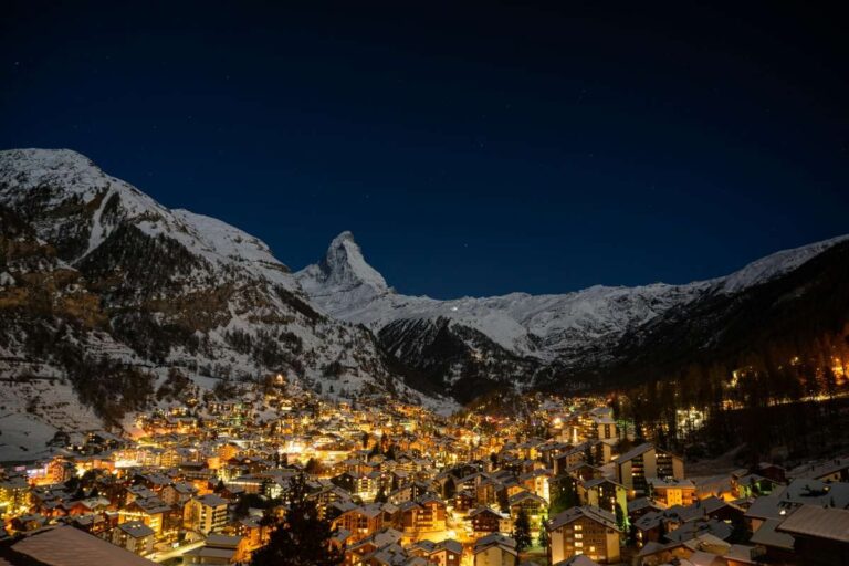 Nighttime panoramic view of Zermatt village and snowy mountain