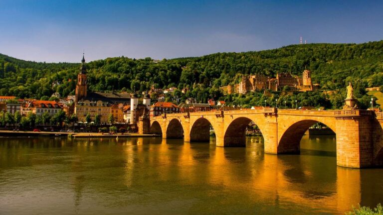 Picturesque view of Heidelberg with the Neckar River reflecting autumn trees