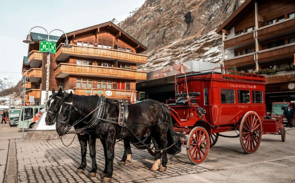 Horse-drawn carriage in Zermatt's snowy mountain setting