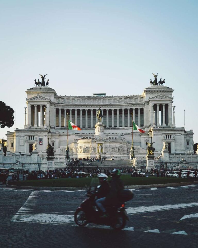 The grand Victor Emmanuel II Monument in Rome with Italian flags