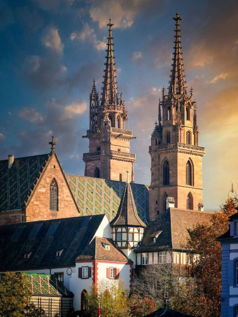 Twin spires of the historic church against a dramatic sky