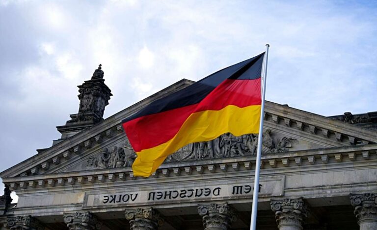 German flag waving outside the Bundestag building in Berlin