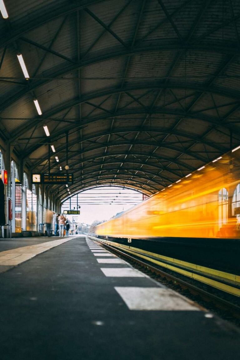 Train rushes through Berlin's station under an arched roof