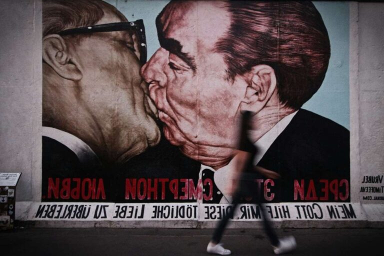 Famous graffiti of leaders kissing on the Berlin Wall