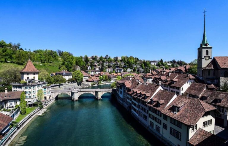 A picturesque view of Bern's old town with a river and historic buildings