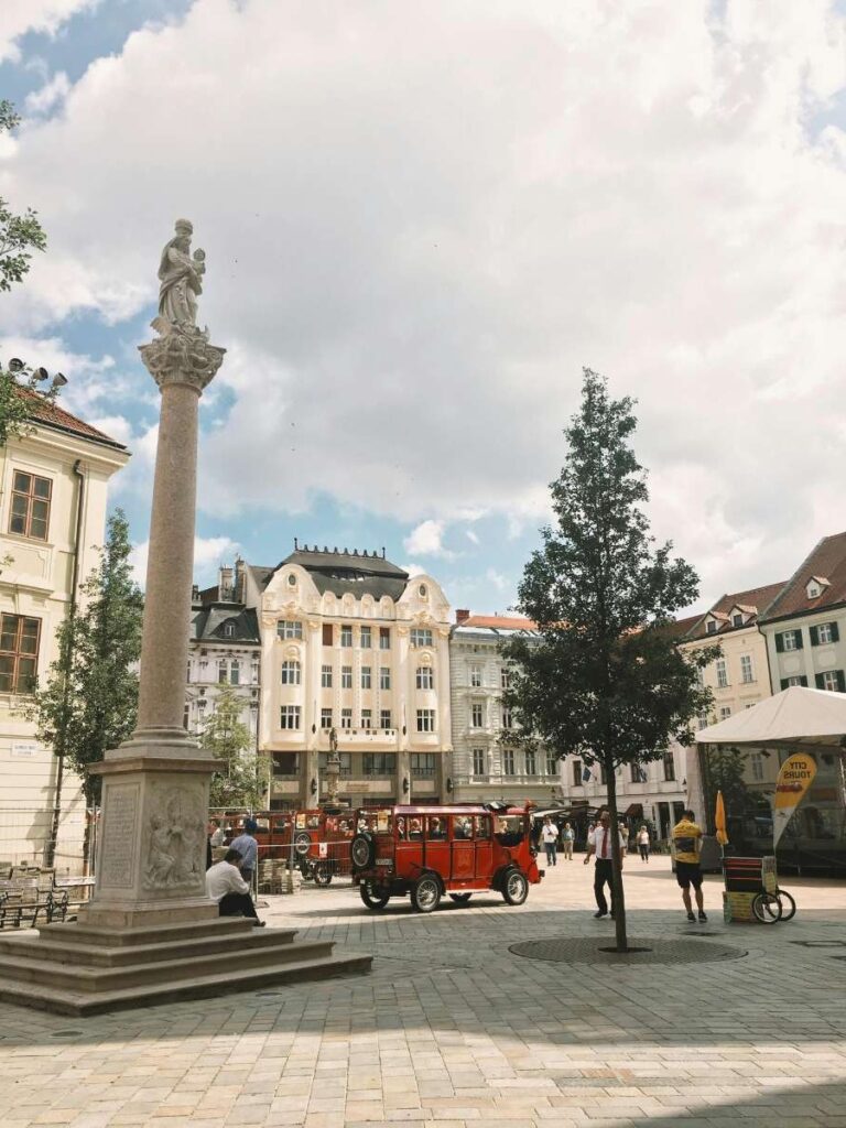 Bratislava city square with a statue and historic buildings