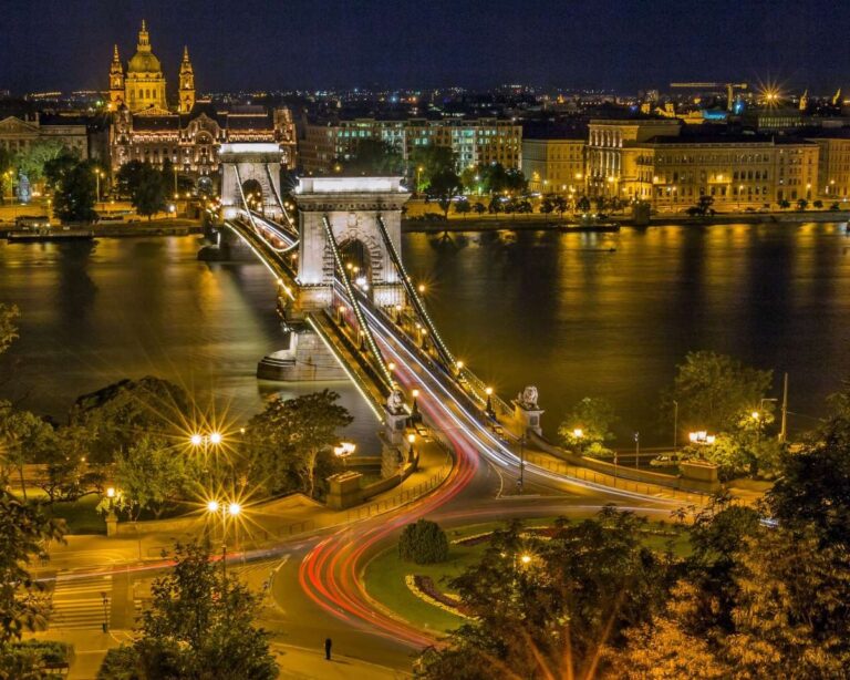 Budapest's Chain Bridge and illuminated buildings along the Danube River at night