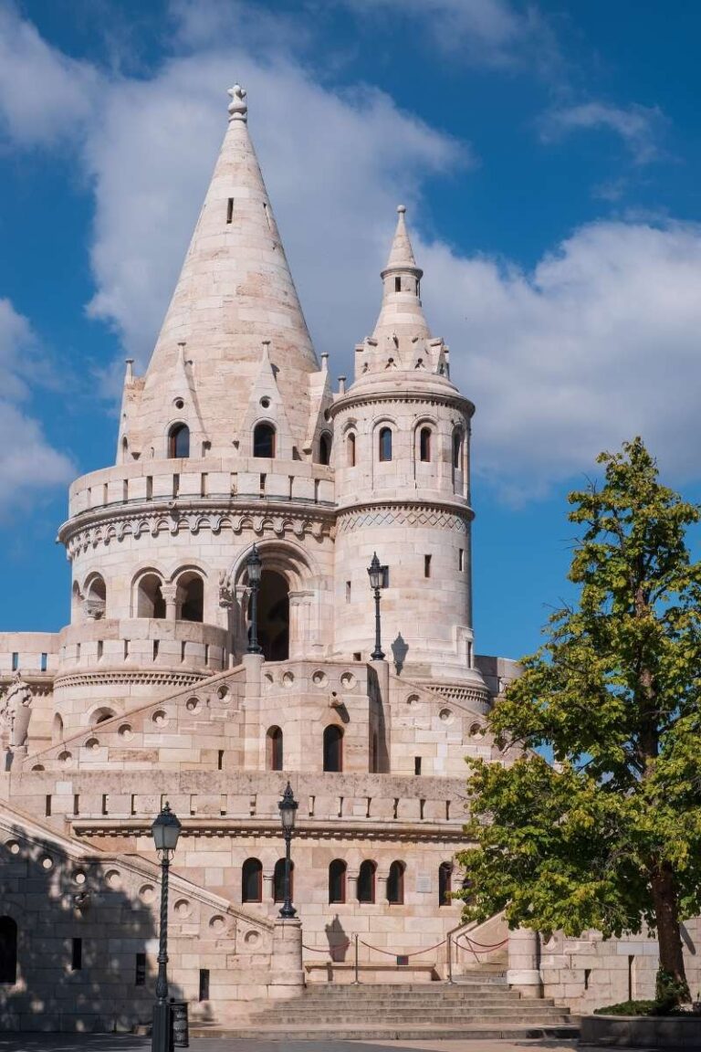 Fisherman's Bastion towers under a clear blue sky in Budapest