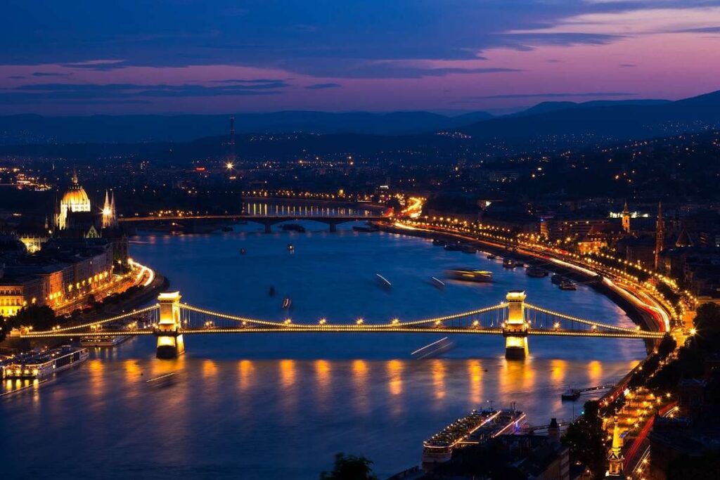 Budapest river view with illuminated bridges at night