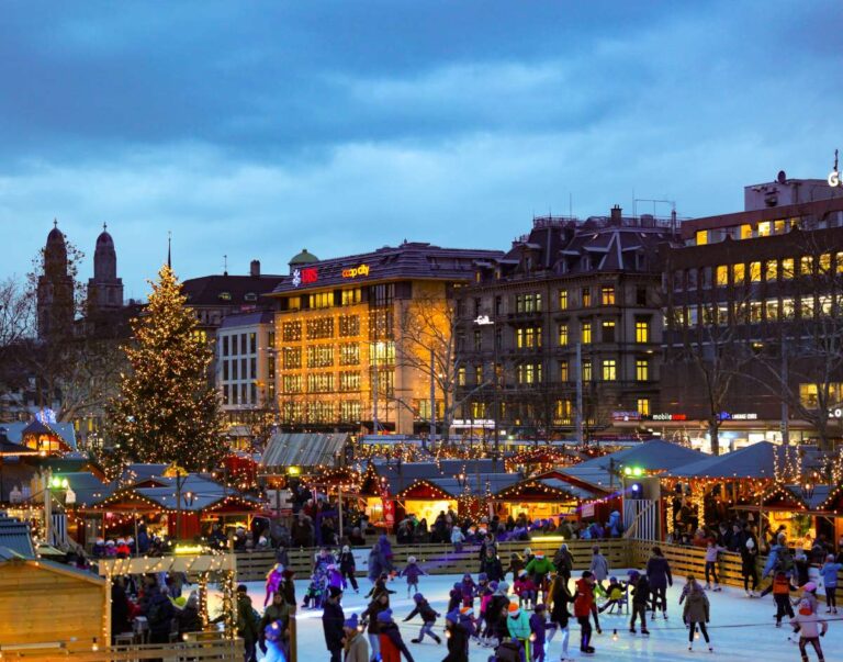 Christmas market in Zurich with people ice skating and little shops