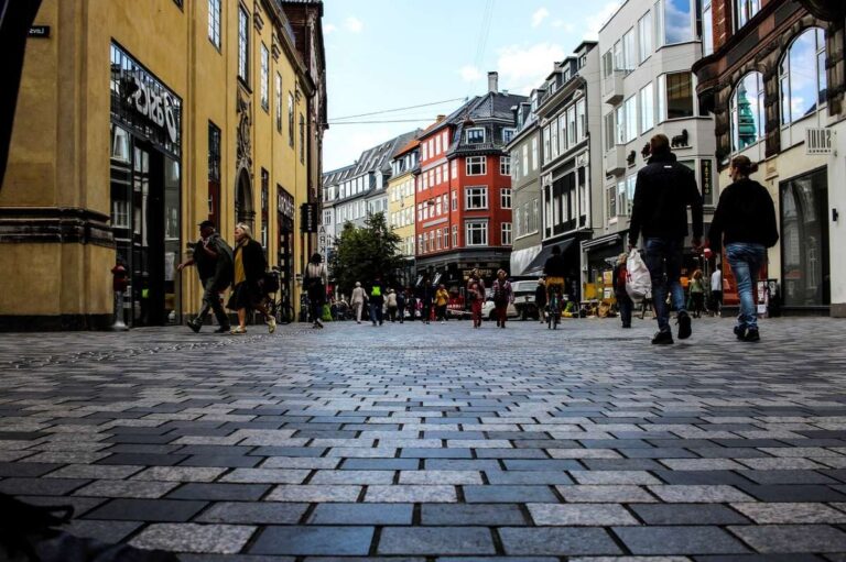 People walking through a busy market square in Copenhagen