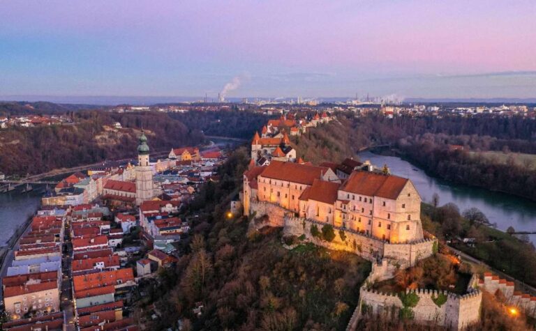 Aerial view of Burghausen Castle, a hilltop fortress at sunset