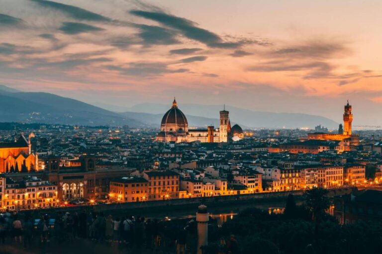 Florence cityscape at sunset, showcasing the Duomo and city lights