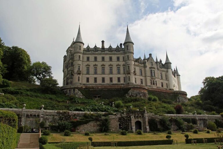 Dunrobin Castle in Scotland with lush green gardens