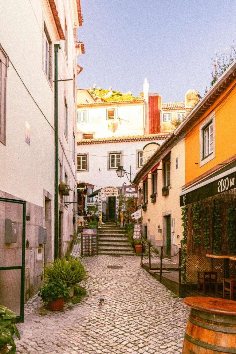 Lisbon's charming old town street with cobblestones and colorful buildings