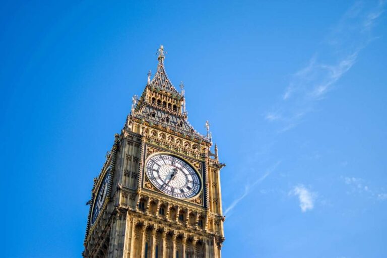 The iconic clock tower, Big Ben, against a bright blue sky