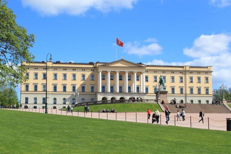 Oslo's Parliament building with people enjoying the sunny day