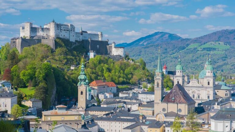 Aerial view of Salzburg with Hohensalzburg Fortress and scenic mountains