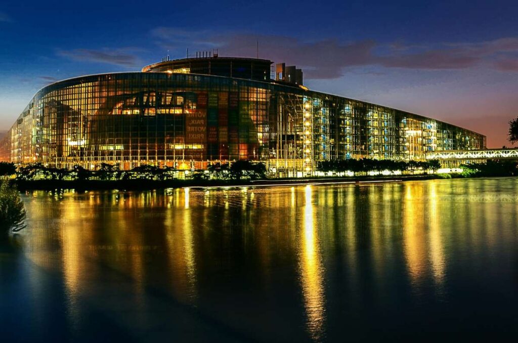 European Parliament building illuminated at night