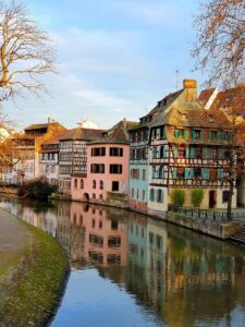 Colorful half-timbered houses by a canal in Strasbourg