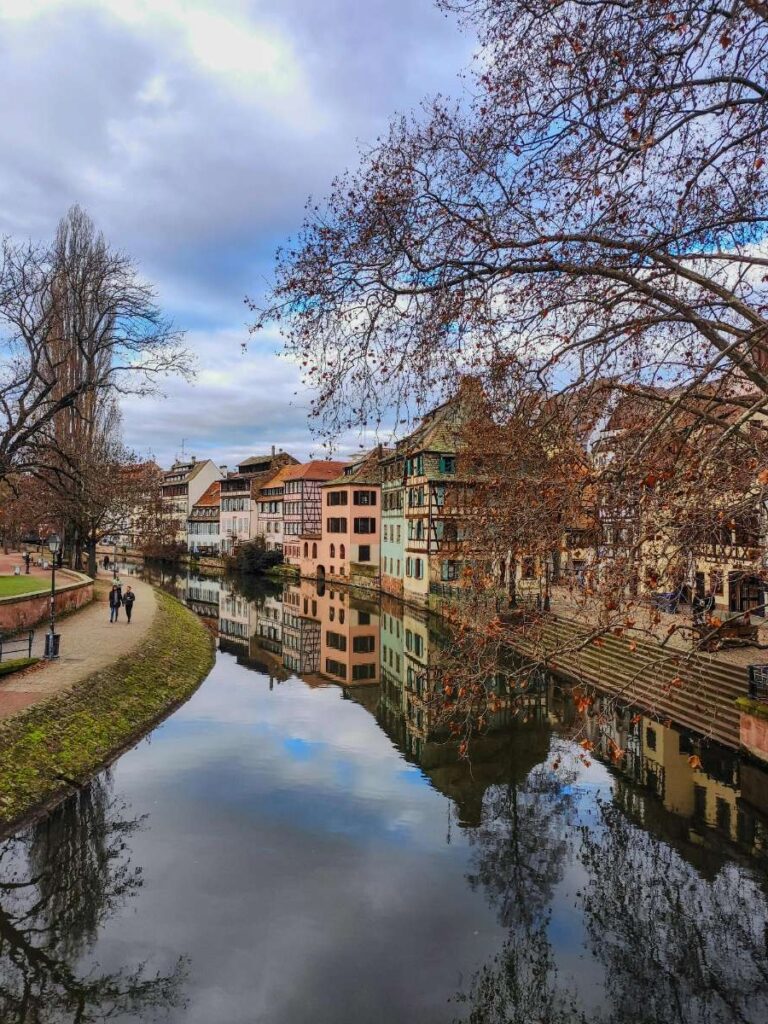 Scenic view of a canal and colorful buildings in Strasbourg