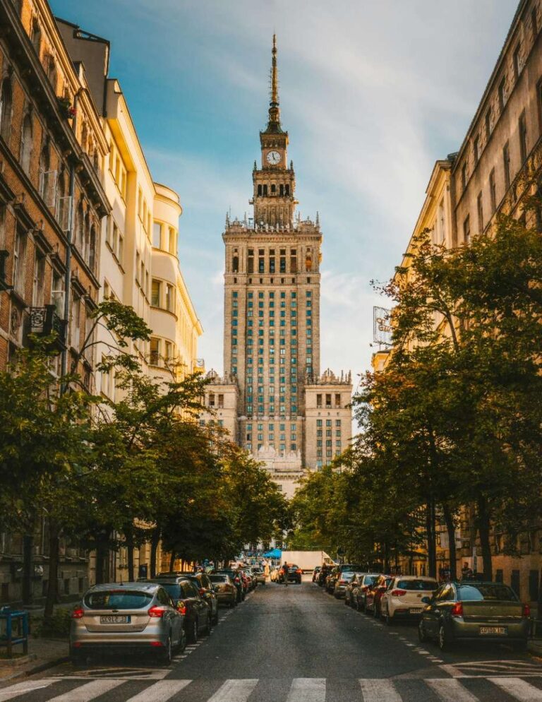 View of Warsaw's Palace of Culture and Science through city street