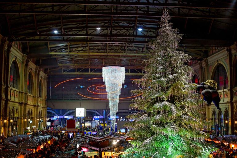 Christmas market in Zurich next to the train station with a huge christmas tree inside