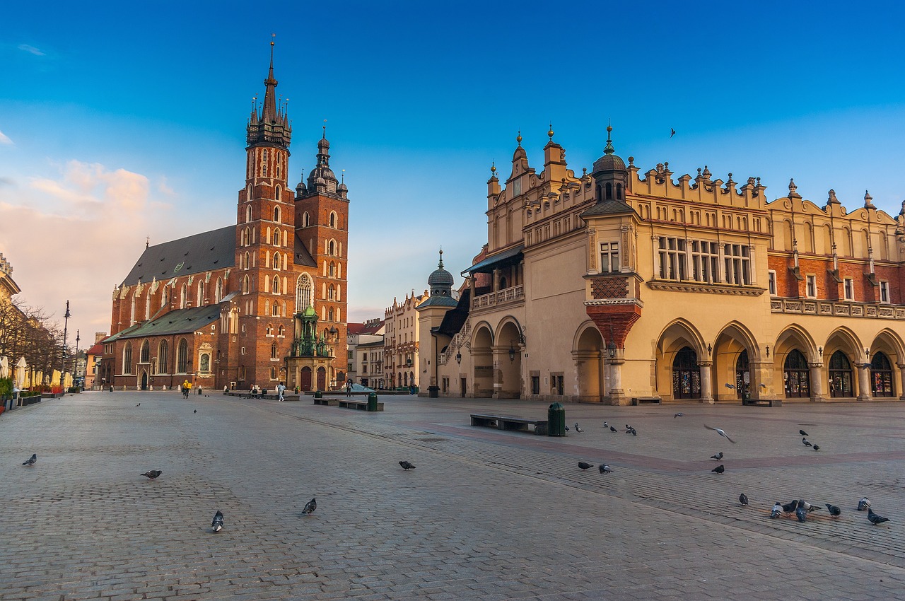 old town market square of Krakow during sun set