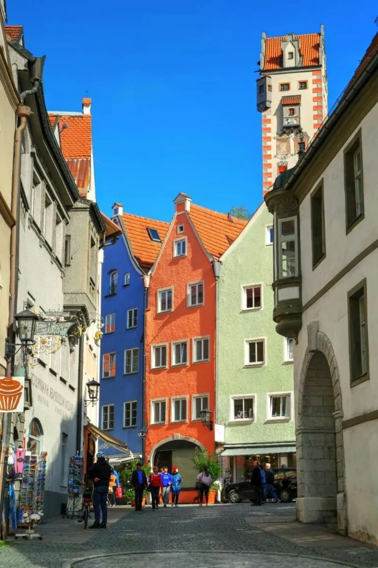 Colorful, narrow street in Fussen's old town with tall, quaint buildings