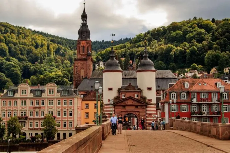 The famous old bridge in Heidelberg with city and forest in the background